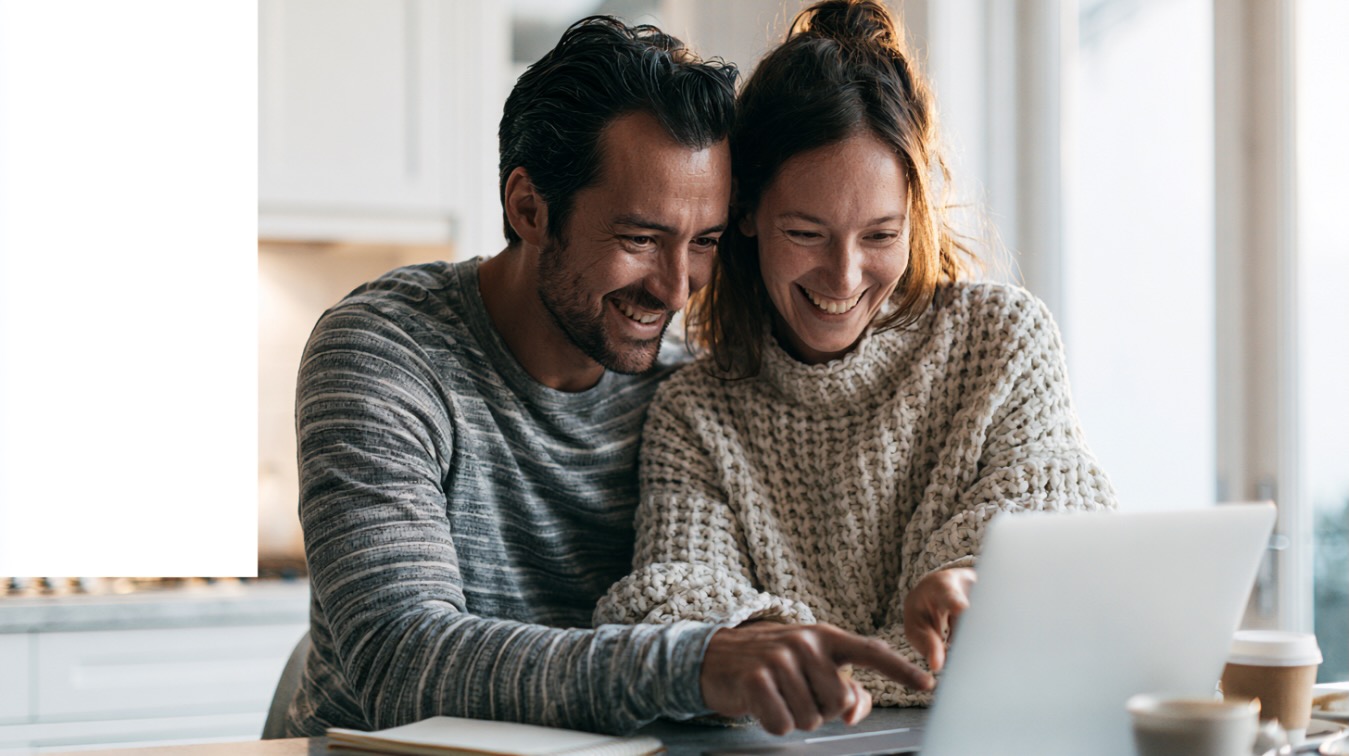 A couple reviewing their mortgage pre-approval budget together